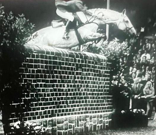 Kathy Kusner jumping Aachen Puissance with Aberali